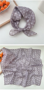 Detail of lavender cotton-linen square scarf with white daisy floral print and rolled hem