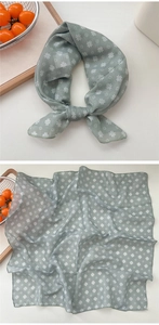 Detail view of mint green floral cotton linen square scarf with white prints