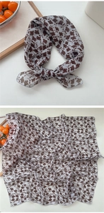 Detail of square cotton-linen scarf with ginkgo leaf pattern in light grey blue and brown