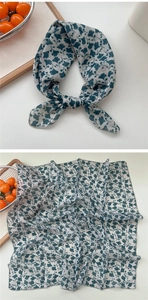 Detailed view of square cotton linen scarf with blue ginkgo leaf print and edge stitching