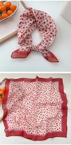 Detail of red rose floral cotton linen square scarf with deep red border edging