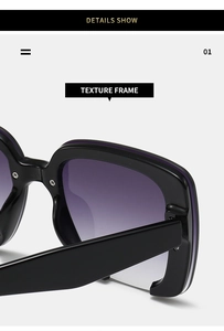 Detail of square black frame sunglasses with purple gradient lenses and metallic hinge
