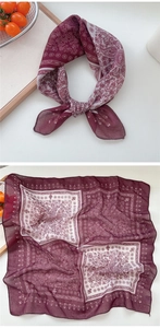 Detail of burgundy paisley cotton linen scarf showing soft texture and vintage pattern