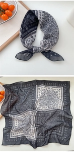 Detail of vintage paisley pattern square scarf in breathable black and white fabric