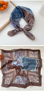 Detailed pattern of paisley cotton linen scarf with vintage floral and geometric borders