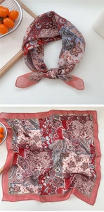 Detail of vintage red paisley pattern cotton linen small square scarf with neat edges