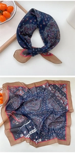 Macro detail of navy paisley cotton linen scarf with vintage border and texture