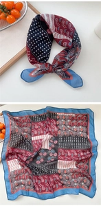 Detail of square paisley scarf showing elegant blue dots and red floral patterns