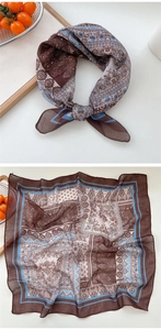 Detail of soft square neckerchief showing brown paisley and blue floral print patterns