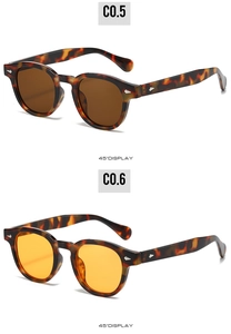 Détail de lunettes de soleil ovales rétro avec rivets et monture en écaille