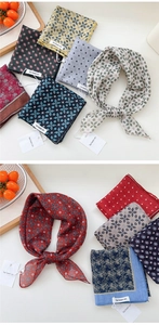 Macro detail of various patterned cotton linen scarves with diverse colorful prints