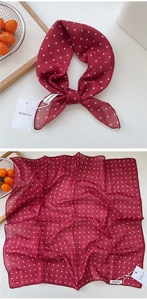 Close-up of red and white polka dot cotton linen square scarf with be keen on brand label