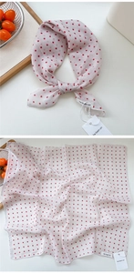 Detail view of cotton linen square scarf with red polka dots and be keen on brand tag