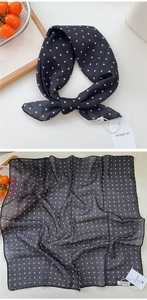 Detailed view of lightweight black and white polka dot cotton linen neckerchief