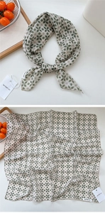 Detail view of cotton linen square scarf with vintage four-leaf clover geometric pattern