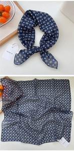Detail view showing knotted and flat navy floral cotton linen square scarf with geometric patterns