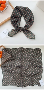 Detail of vintage floral cotton linen neckerchief showing texture and green print pattern