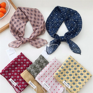 Collection of printed cotton linen scarves in various vintage patterns for summer styling