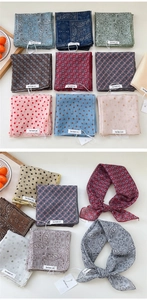 Detailed flat lay of cotton-linen scarves featuring polka dot and bohemian floral patterns
