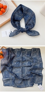 Detailed view of navy blue paisley silk scarf with vintage bohemian pattern and tags