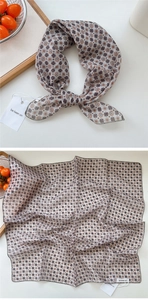 Detailed view of geometric floral cotton linen scarf with fine hem and brand tag
