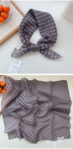 Detailed view of polka dot cotton linen neckerchief tied elegantly in a lifestyle setting