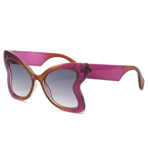 Modern oversized butterfly sunglasses with purple and amber gradient frames and gray lenses
