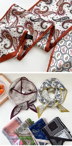 Close-up of silk neckerchief with classic paisley patterns and geometric designs