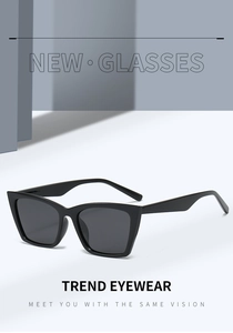 Detail of trendy black cat-eye square sunglasses with polarized lenses and a thick frame