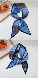 Detail of blue paisley long silk ribbon scarf with polka dots for neck or bag