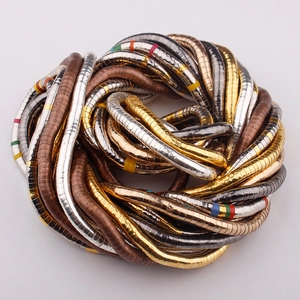 Flexible snake-bone necklace in gold, silver, and bronze finish with colorful accents