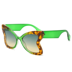 Modern butterfly sunglasses with leopard tortoiseshell frames and translucent green temples