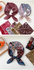 Multiple styles of patterned silk scarves in paisley, floral, and mandala prints for women