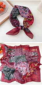 Macro shot of vintage red floral and geometric pattern square silk scarf details