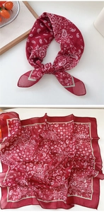 Deep red paisley silk square scarf shown folded and flat with decorative white patterns