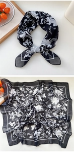 Detail view of black and white floral print square scarf with delicate botanical pattern