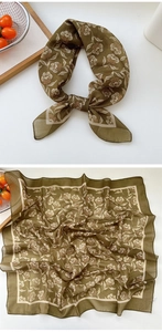Detail view of small square floral scarf in vintage olive green and yellow pattern