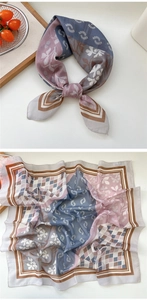 Detail of elegant printed square silk scarf with geometric patterns and floral motifs