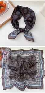 Detail of silk square scarf showing vintage floral patterns and smooth satin texture