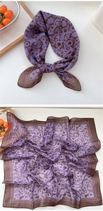 Detail view of square floral scarf with purple trim and delicate chiffon texture