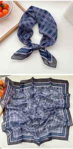 Détail d'un foulard carré à carreaux bleu marine en soie avec bordure violette