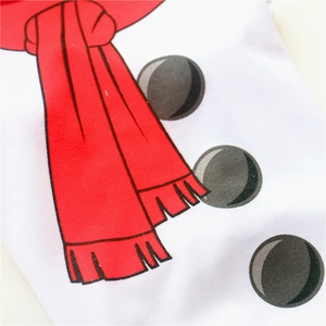 Detailed view of snowman print on soft white cotton dog T-shirt with festive red scarf