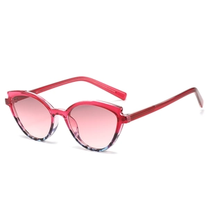 Cat eye sunglasses with transparent red TR90 frames and pink gradient lenses