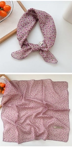Detail of pink floral cotton linen scarf with purple crochet edges and explore label