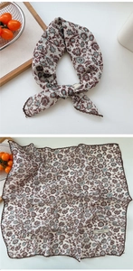 Macro detail of floral linen scarf with vintage pattern and scalloped crochet lace edges