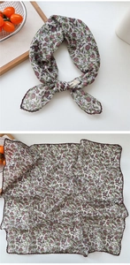 Close-up of floral cashew linen silk scarf featuring delicate scalloped lace edges