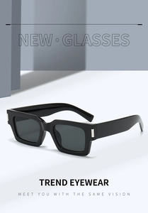 Detailed close-up of rectangular black sunglasses with silver metal temple accents
