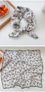 Detail of floral cotton linen neckerchief with red blossoms and green lace trim borders