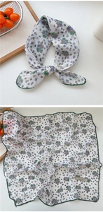 Close-up of floral cotton linen square scarf with green knit lace trim and explore label