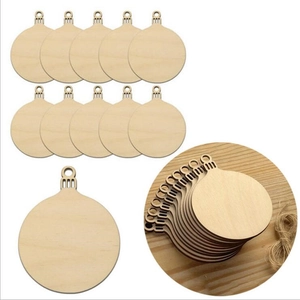 Macro view of ten round blank boxwood ornaments with natural wood grain and twine cords